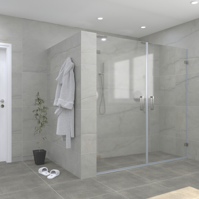 Modern glass walk-in shower with double doors, stylish grey tiles and accessories for a luxury bathroom experience.