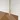 Messing shower wall stabilisation rod with minimalist design, suitable for modern bathrooms, attached to glass wall.