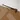 Matt bronze shower wall stabiliser, sleek design, square mounting, suitable for modern bathrooms.