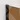 Mat black shower wall with amber-coloured safety glass, sleek profile and modern design for a stylish bathroom.