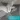Waschbeckenunterschrank mit grauer Ausführung und cleverer Siphonaussparung für optimale Raumausnutzung im Badezimmer.