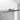 Graue Glas-Duschwand mit minimalistischem Metallscharnier-System, perfekt für einen modernen Badezimmerstil.