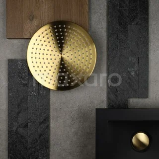 Gold round rain shower head in modern design, ideal as a stylish addition to any luxury bathroom environment.