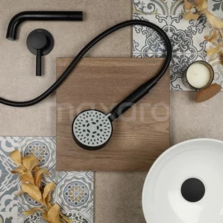 Black handheld shower with round head and matte finish, ideal as a stylish addition to a modern bathroom.