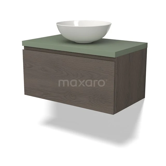 Houten zwevend badkamermeubel met groene blad en witte opzetkom, stijlvolle opbergoplossing voor moderne badkamers.