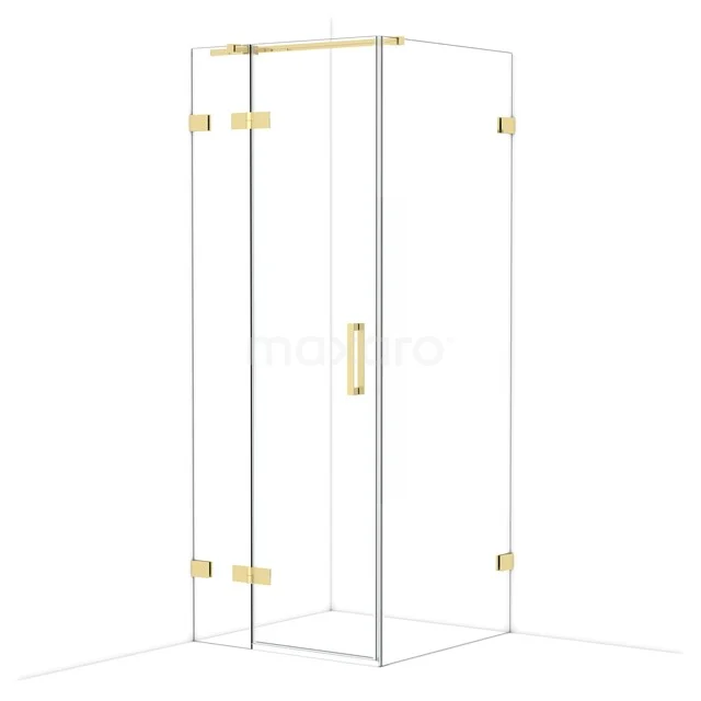 Glass shower cabin with gold-coloured hinges and handle, modern design for a luxury bathroom.