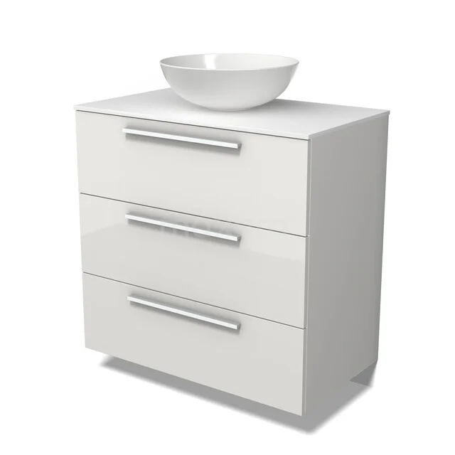 Wit badkamermeubel met drie lades, moderne handgrepen en een losstaand ronde waskom van keramiek bovenop.