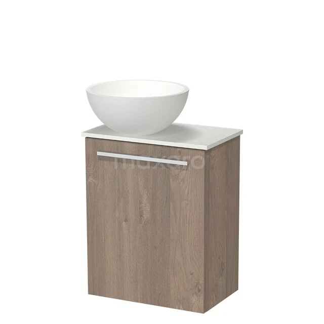 Wooden bathroom furniture with a matte white bowl-shaped sink; compact design ideal for modern bathroom decor.