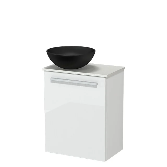 White bathroom furniture with a black ceramic sink, modern design and compact shape, ideal for small bathrooms.