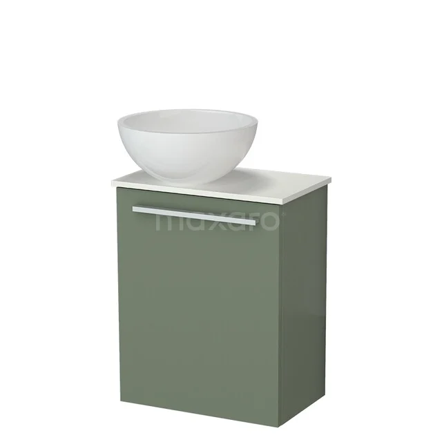 Green bathroom furniture with white bowl-shaped sink, modern design, ideal for small bathrooms.