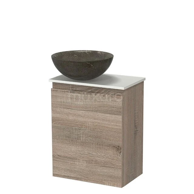 Wooden bathroom furniture with marble washbasin, compact design, ideal for a modern bathroom decor.