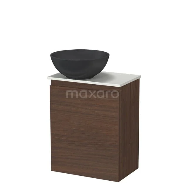 Wooden bathroom furniture with marble top and black washbasin, modern design for stylish bathroom decor.