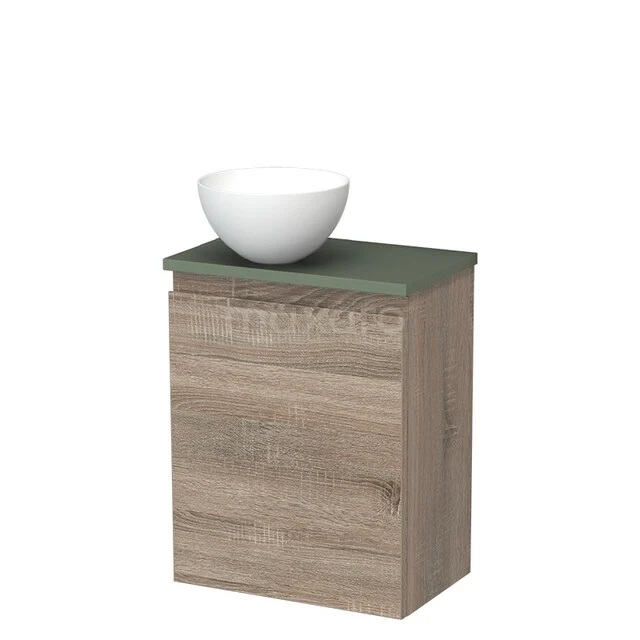 Houten badkamermeubel met groen blad en witte komvormige wastafel, modern design voor een stijlvolle badkamer.