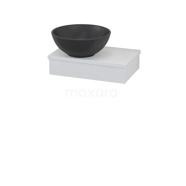 Black ceramic countertop basin on white bathroom unit, sleek design.