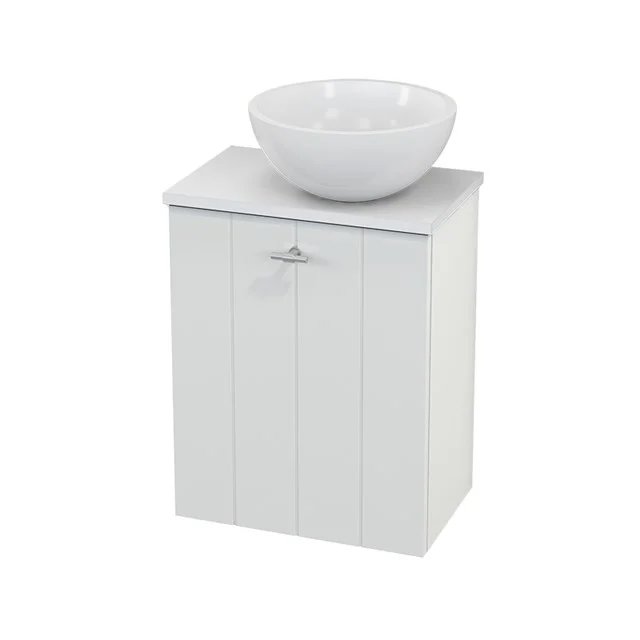 White wooden bathroom cabinet with vertical grooves, on top of a round basin; ideal storage solution for compact bathrooms.