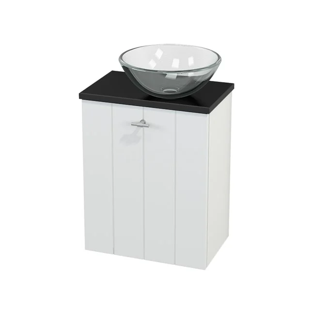 White bathroom unit with vanity units for countertop wash basin and black top, compact design with wooden panels for a stylish cloakroom.