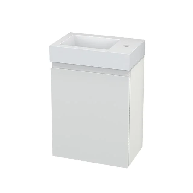 Compact white vanity unit with integrated sink, ideal for bathrooms with limited space, made of durable materials.
