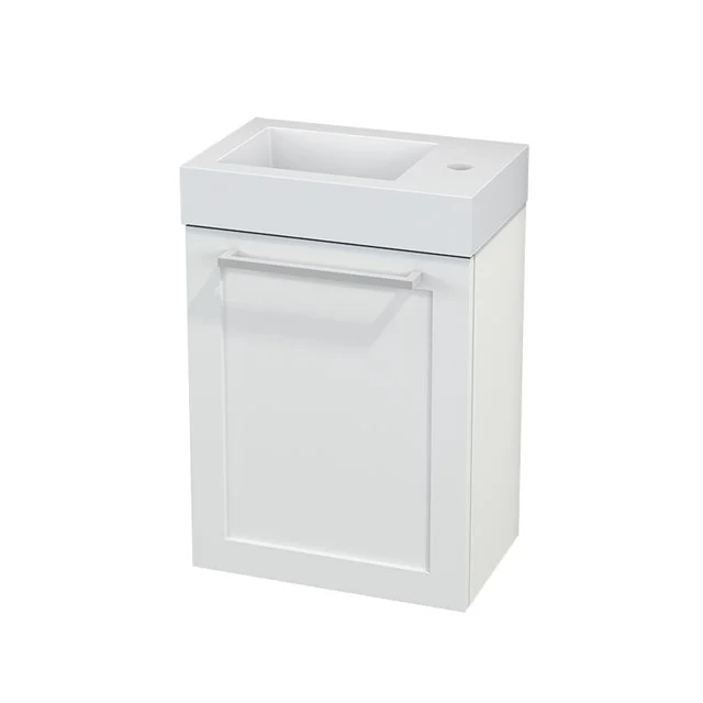 White Bathroom unit with sink, compact design, ideal for small bathrooms; stylish and functional with storage space.