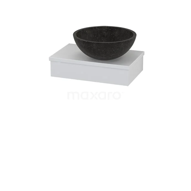 Black natural stone countertop wash basin on a white rectangular basin; stylish bathroom design.