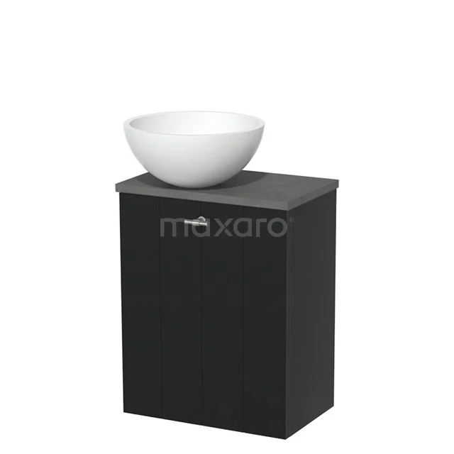 Black bathroom unit with countertop basin in ceramic, compact shape for modern bathrooms, ideal for small spaces.