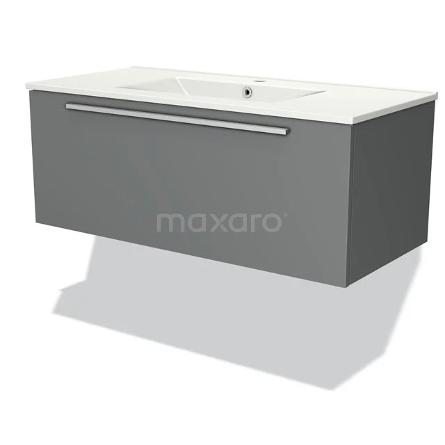 Graue Badmöbelset mit mattem Oberfläche und integriertem Waschbecken, minimalistisches Design und silberner Haltegriff.