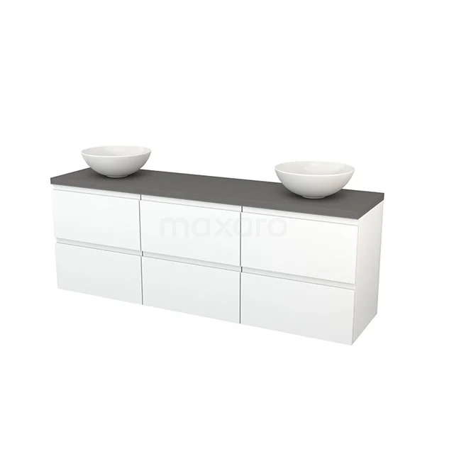 White bathroom unit with three drawers, black stone worktop and two round countertop wash basins; modern design for stylish bathrooms.