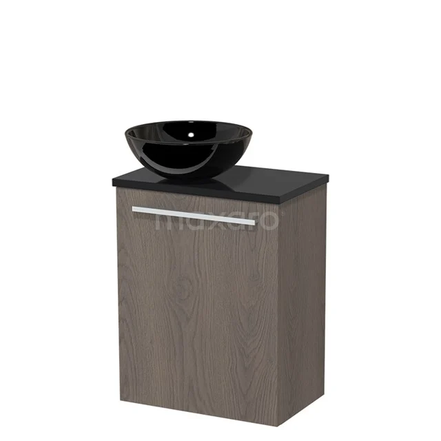 Bathroom cabinet with black countertop wash basin, modern design, featuring a compact door and a dark stone-style worktop.