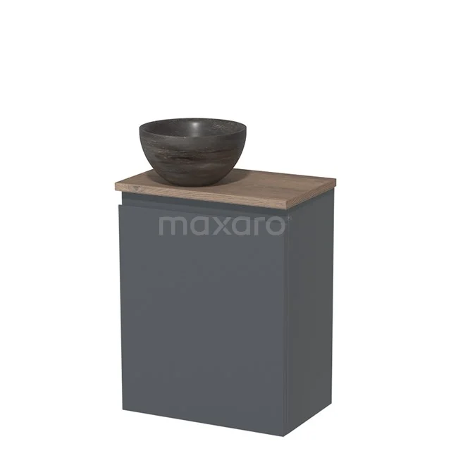 Donkergrijze badkamerkast met hout-look blad en ronde, antracietkleurige waskom. Compact ontwerp, ideaal voor moderne badkamers.