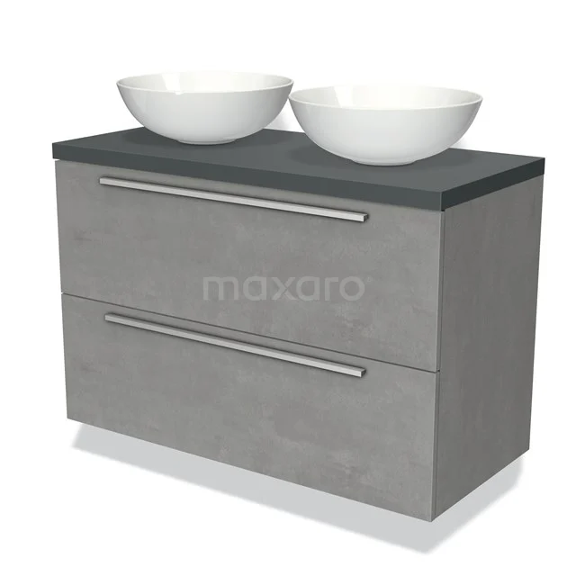 Graues Badezimmermöbel mit Betonoptik, zwei weißen Aufsatzwaschbecken und chromfarbenen Haltegriffen, ideal für ein modernes Badezimmer.