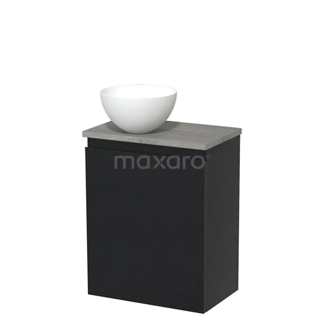 Zwart badkamermeubel met betongrijs blad en witte opbouwwaskom, modern design, ideaal voor kleine badkamers.