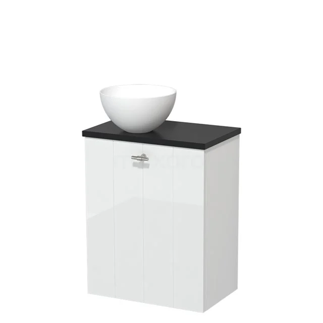 Wit badkamermeubel met zwarte bovenkant en losse witte wastafelkom, modern design van hoogglansmateriaal.