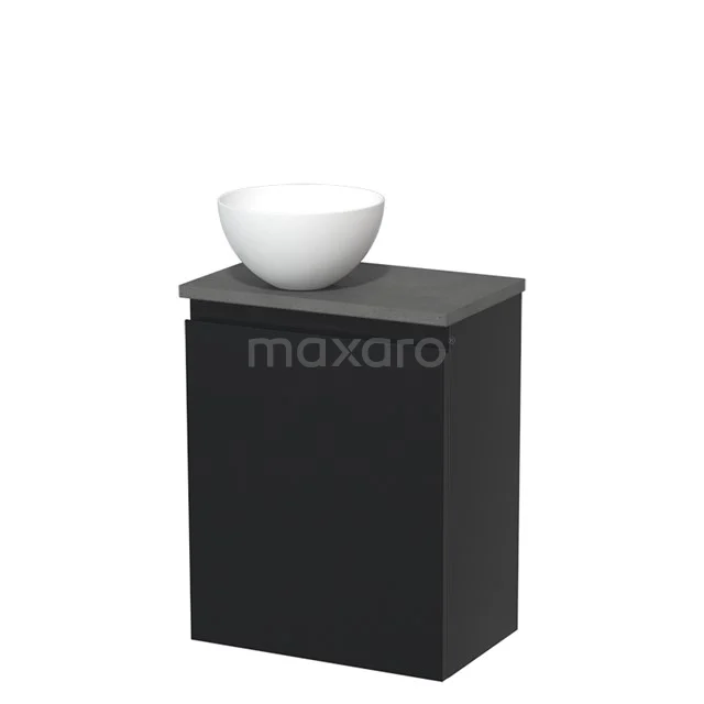 Zwart badkamermeubel met mat afwerking en wit ronde wastafel, compact design voor moderne badkamers.