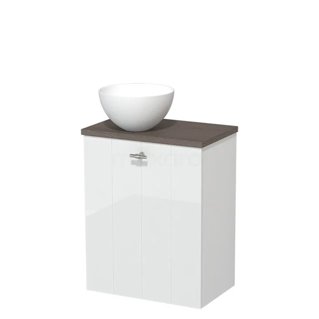Wit badkamermeubel met donkere houten top en ronde wastafel, modern design geschikt voor compacte badkamers.
