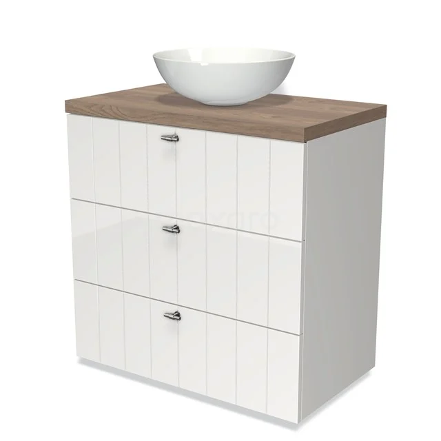 White bathroom unit with wood-look worktop, surface-mounted ceramic basin and three drawers with vertical grooves in modern design.