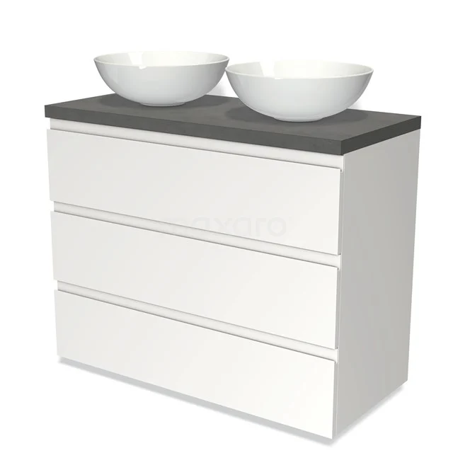 Weißes Badezimmermöbel mit drei Schubladen, grauer Steinplatte und zwei runden weißen Aufsatzwaschbecken, modernes Design.