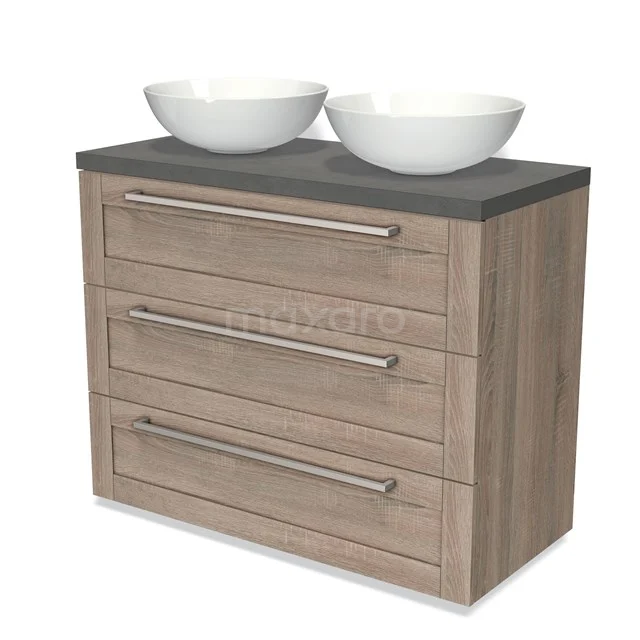 Modulo Plato Vanity units for countertop basin | 100 cm Oak Frame front Dark grey concrete worktop 3 drawers BMK19-00728 Wooden bathroom unit with dark grey worktop and two white ceramic countertop wash basins, three drawers with metal handles.