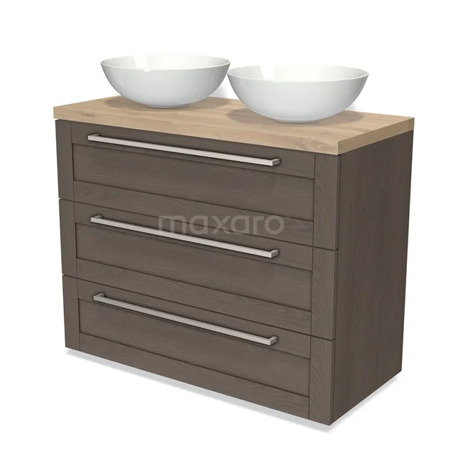 Wooden bathroom unit with two white countertop wash basins, three drawers and chrome handles, ideal for a modern bathroom style.