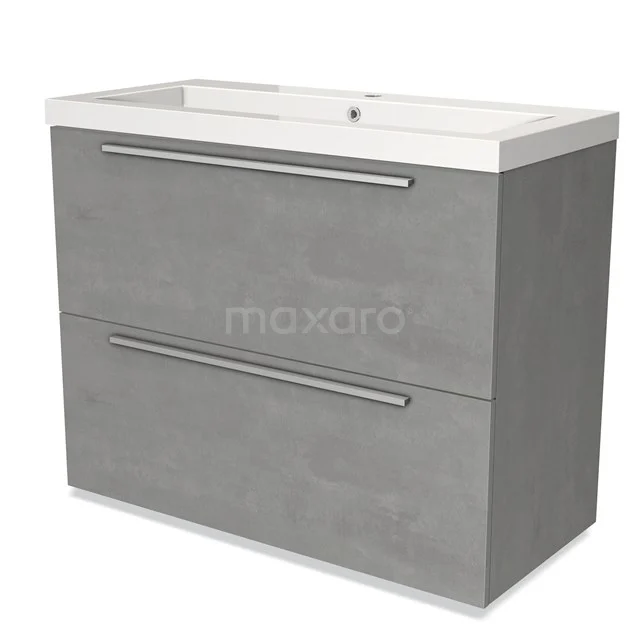 Grijze badkamermeubelset met twee lades, modern betonlook design, chrome handgrepen en witte wastafel geïntegreerd bovenop.