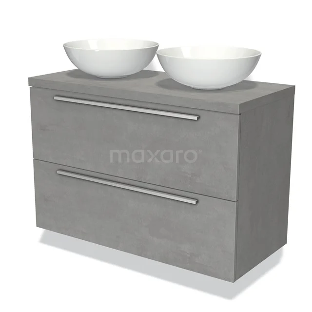 Grijze badkamermeubelset met twee witte waskommen en metalen handgrepen, uitgevoerd in betonlook voor een moderne uitstraling.