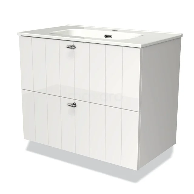 White bathroom unit with integrated basin, two drawers with vertical grooves and chrome handles, modern bathroom design.
