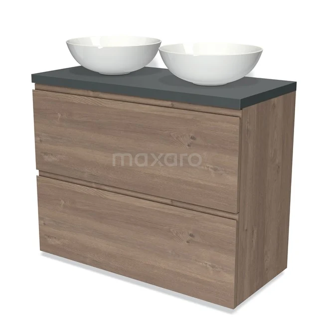 Modulo Plato Badmöbel mit Aufsatzwaschbecken | 100 cm Mittelbraune Eiche Grifflos front Dunkelgrau blatt 2 hohe Schubladen übereinanderliegend BMK13-00957 Holz-Badmöbel mit zwei Schubladen, graue Platte und weißem Doppelwaschbecken; modernes Design für moderne Bäder.