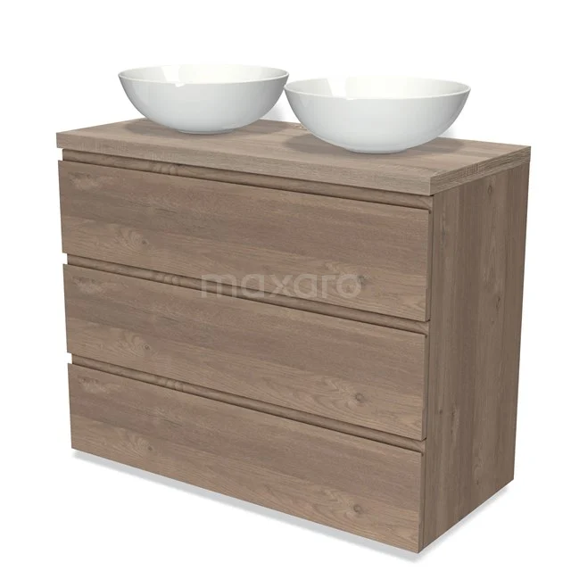 Badmöbel für Aufsatzwaschbecken 100cm Modulo Plato mittelbraune Eiche 3 Schubladen grifflose Platte BMK19-01407 Holz-Waschtisch mit 3 Schubladen in Eichenoptik und doppelten weißen Aufsatzwaschbecken, perfekt für ein modernes Badezimmer.