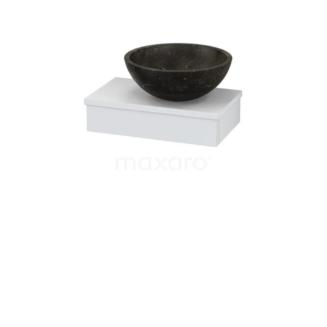 Black natural stone countertop wash basin on white ceramic sink; modern bathroom design with unique contrasts.