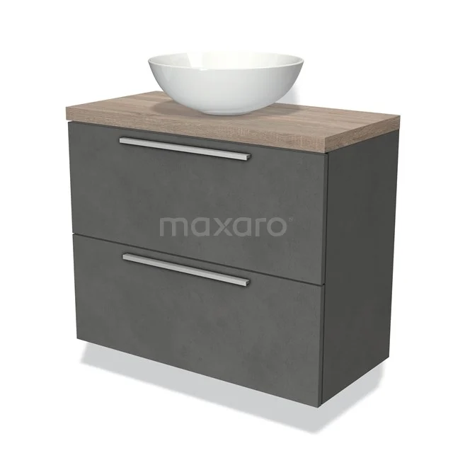 Grijze badkamermeubel met houtlook blad, witte keramische waskom en twee lades met metalen handgrepen.