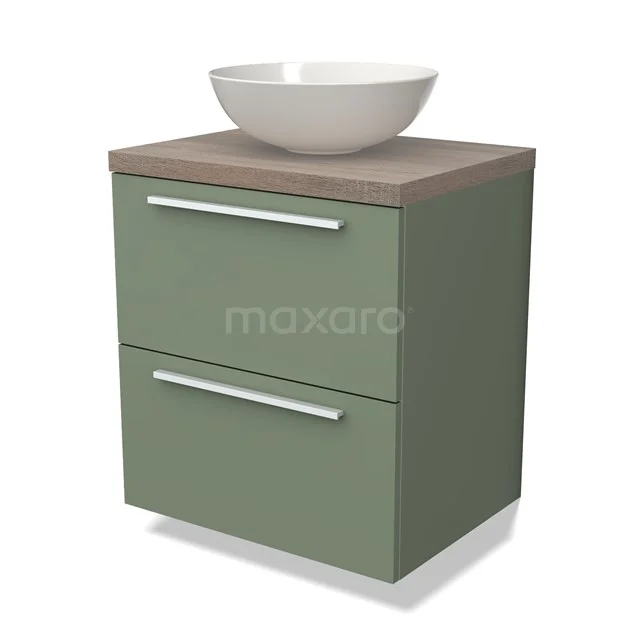 Groene badkamermeubel met houtlook blad, witte opzetwaskom en twee lades met strakke handgrepen.