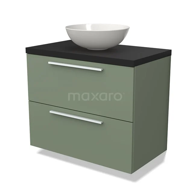 Groene badkamerkast met mat zwarte bovenblad, witte ronde opzetwastafel en twee lades met zilveren handgrepen.