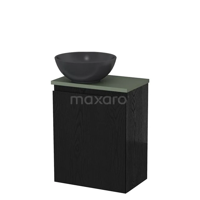 Zwarte badkamerkast met groene wastafelblad en donkere ronde waskom, ideaal voor een moderne badkamer inrichting.