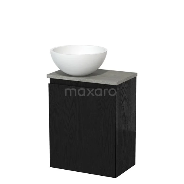 Zwarte wastafelmeubel met betonnen blad en ronde witte waskom, ideaal als moderne toevoeging aan uw badkamer.