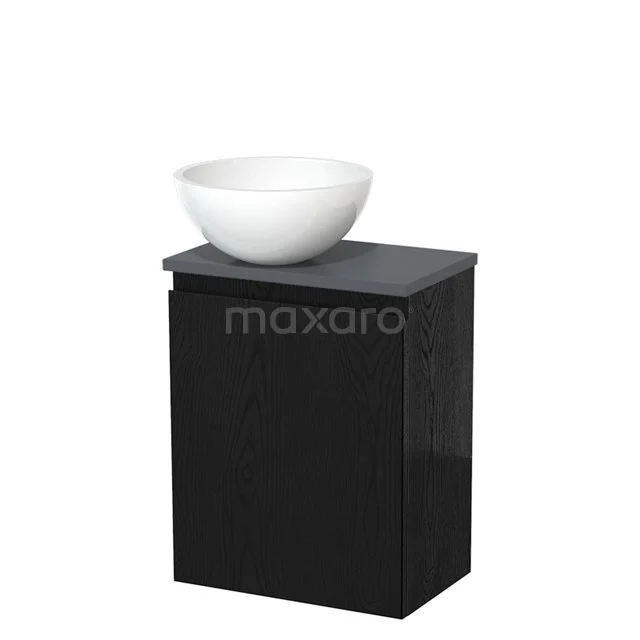 Zwarte wastafelmeubel met matte afwerking, witte ronde opzetwaskom, perfect voor moderne badkamerinrichtingen.