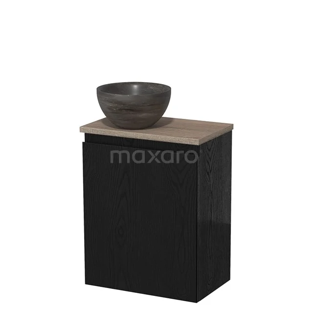 Zwart badkamermeubel met houten blad en ronde, grijze waskom; compact en modern design.